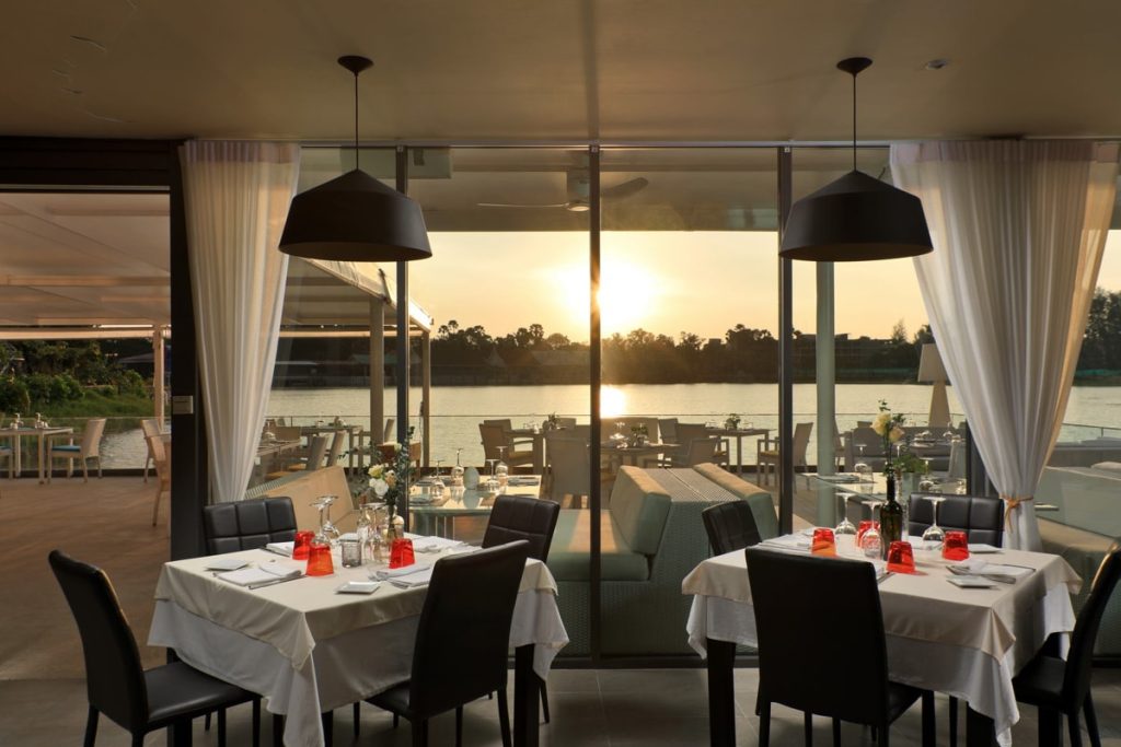 Indoor dining room with lake view at sunset