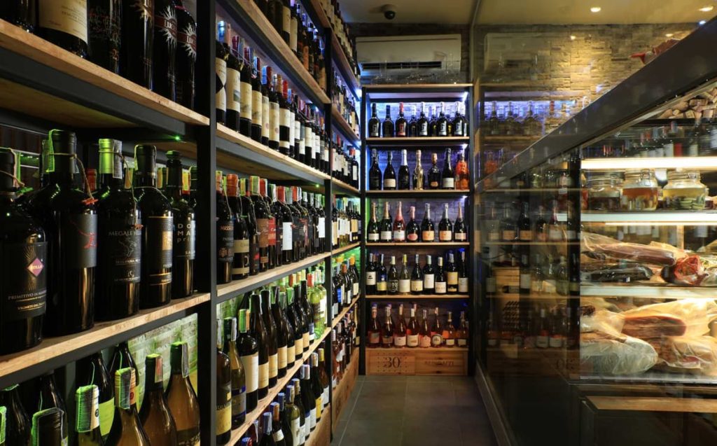 Wine shelves and Italian deli counter at Bocconcino