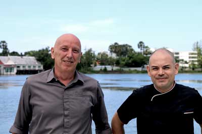 Alessandro Pegoraro and chef Massimo Pettinau by the lake at Bocconcino